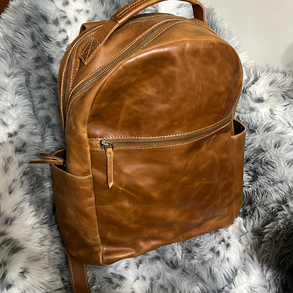 Unisex leather backpack.. absolutely fantastic just purging closets.